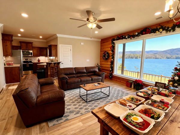 A beautifully plated Christmas dinner in takeout containers being arranged on a rustic wooden dining table inside a cozy cabin with lake views through large windows, Christmas decorations visible, Ozark Mountains in background
